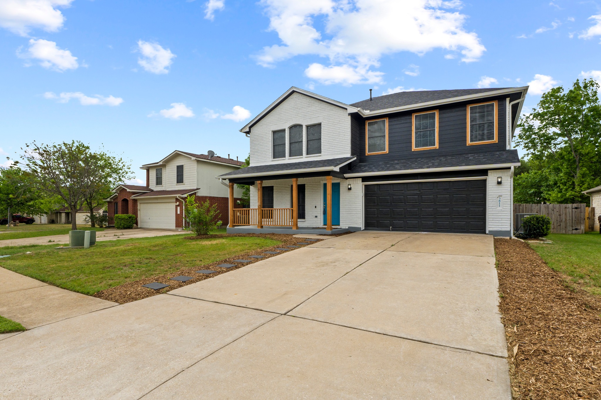 3811 Laurel Ridge Drive Round Rock, TX 78665 - Photo 6 of 35 a front view of a house with a yard and a garage
