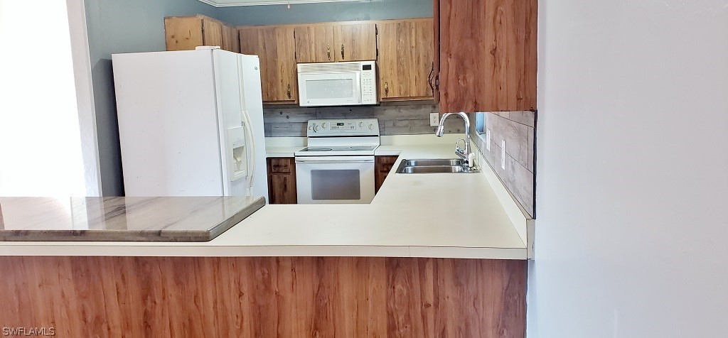 18462 Violet Road Fort Myers, FL 33967 - Photo 8 of 28 a kitchen with a refrigerator and a sink