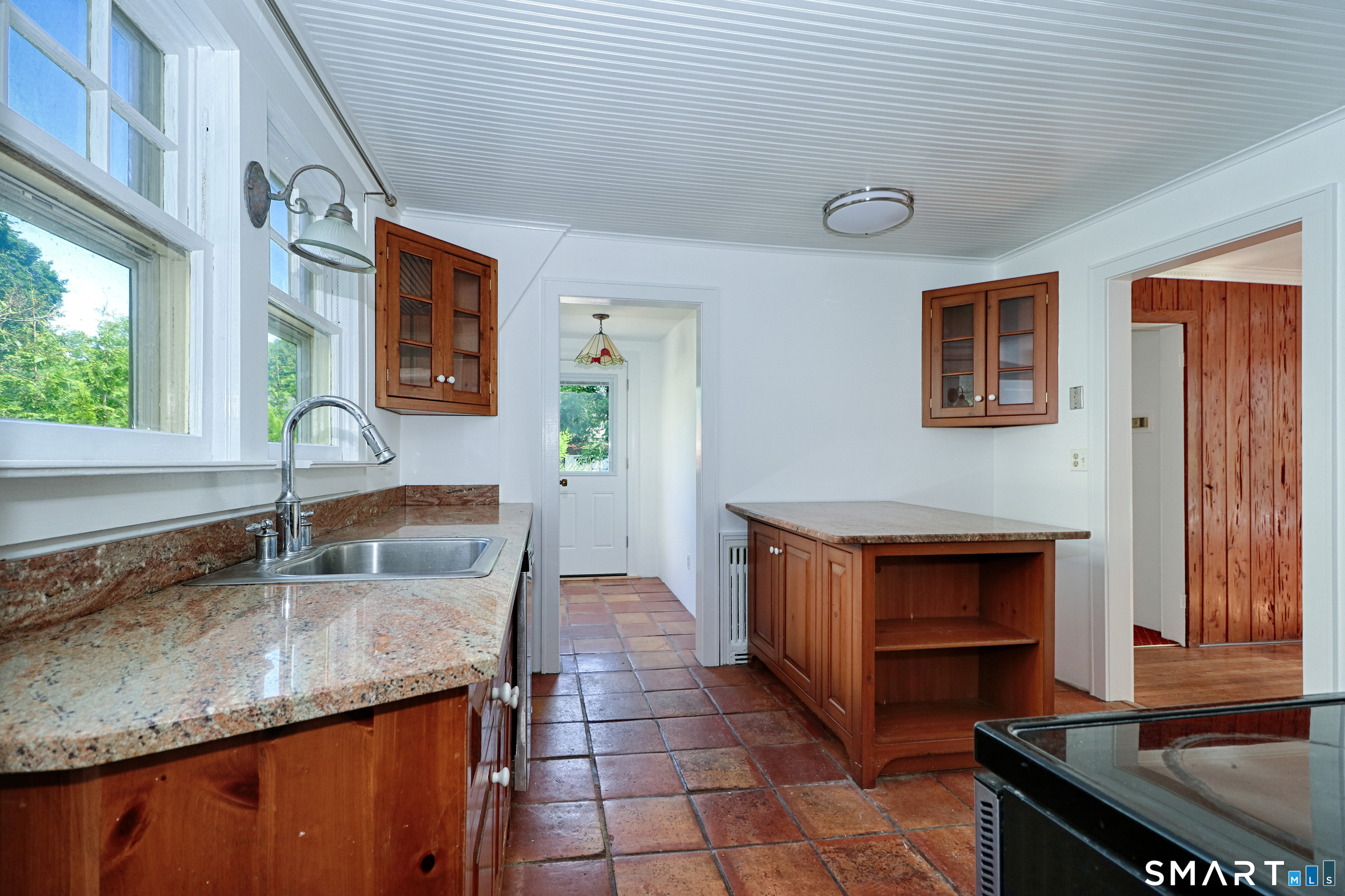 104 Henderson Road Fairfield, CT 06824 - Photo 15 of 26 Eat-On Kitchen with a mudroom and access to the large deck and backyard.