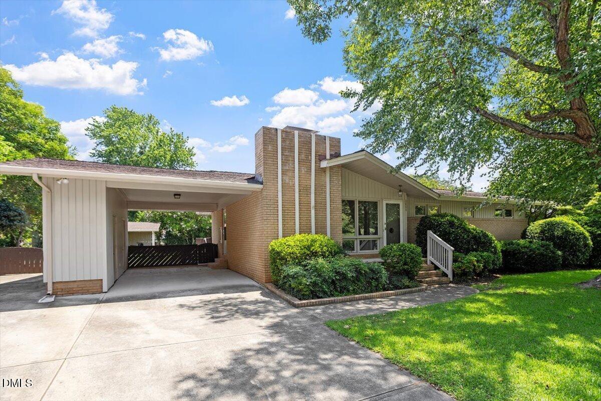 3804 Bland Road Raleigh, NC 27609 - Photo 2 of 34 a view of a house with a yard and potted plants