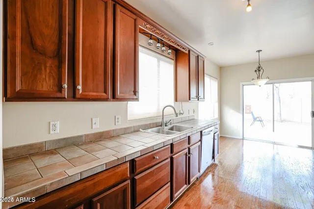 a kitchen with a sink and a window