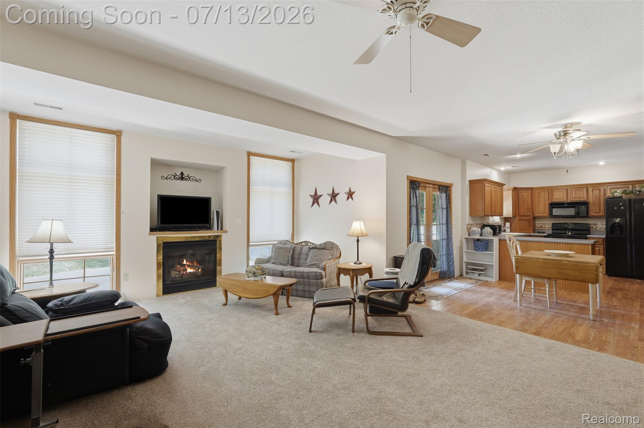 10525 Antcliff Road Brooklyn, MI 49230 - Photo 31 of 80 Open-concept lower level living space featuring a fireplace with views of nature