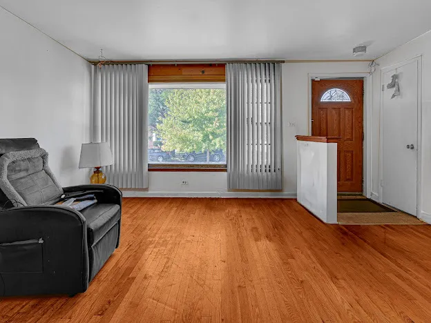 a view of a livingroom with furniture and wooden floor