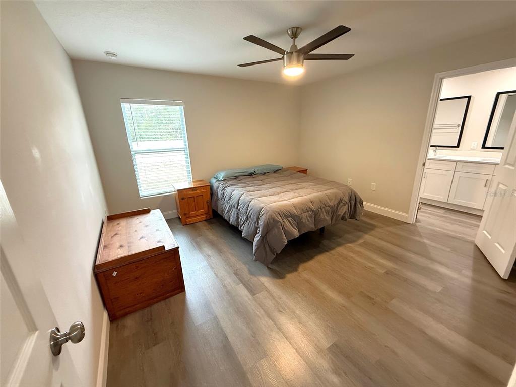 3791 Southwest 166th Pl Road Ocala, FL 34473 - Photo 11 of 43 a living room with a bed furniture and a window
