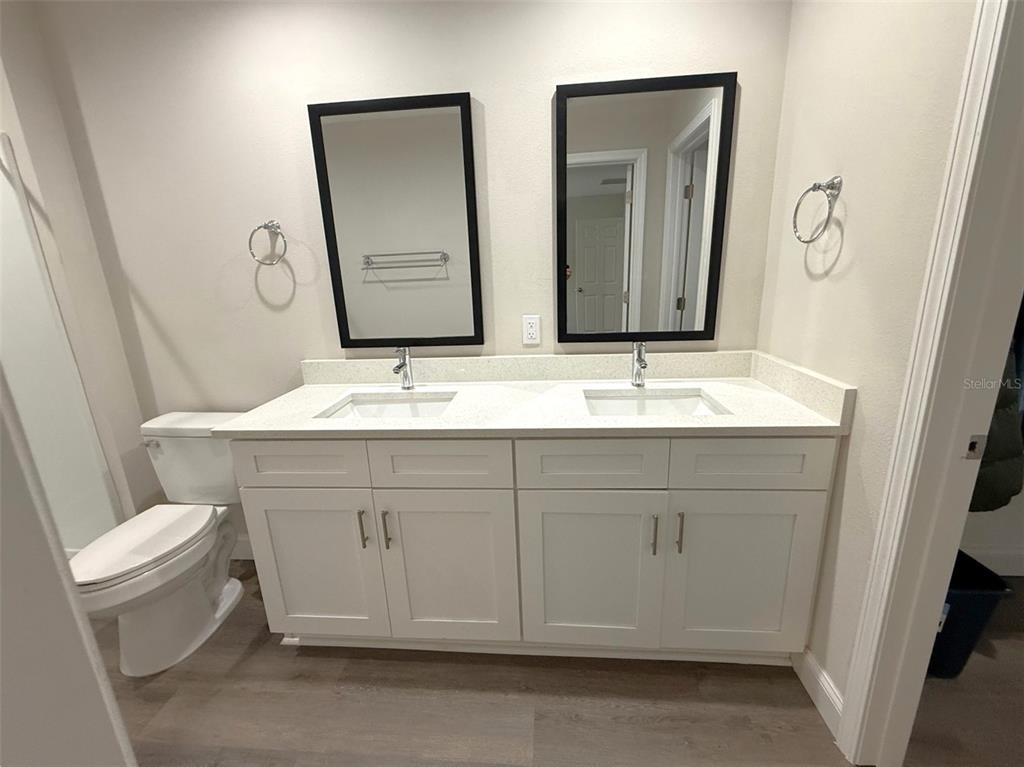 3791 Southwest 166th Pl Road Ocala, FL 34473 - Photo 15 of 43 a bathroom with double vanity sink and a mirror