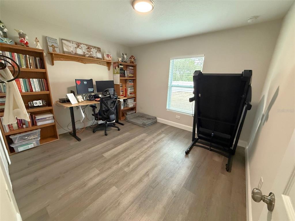 3791 Southwest 166th Pl Road Ocala, FL 34473 - Photo 21 of 43 a view of a workspace with furniture and a window