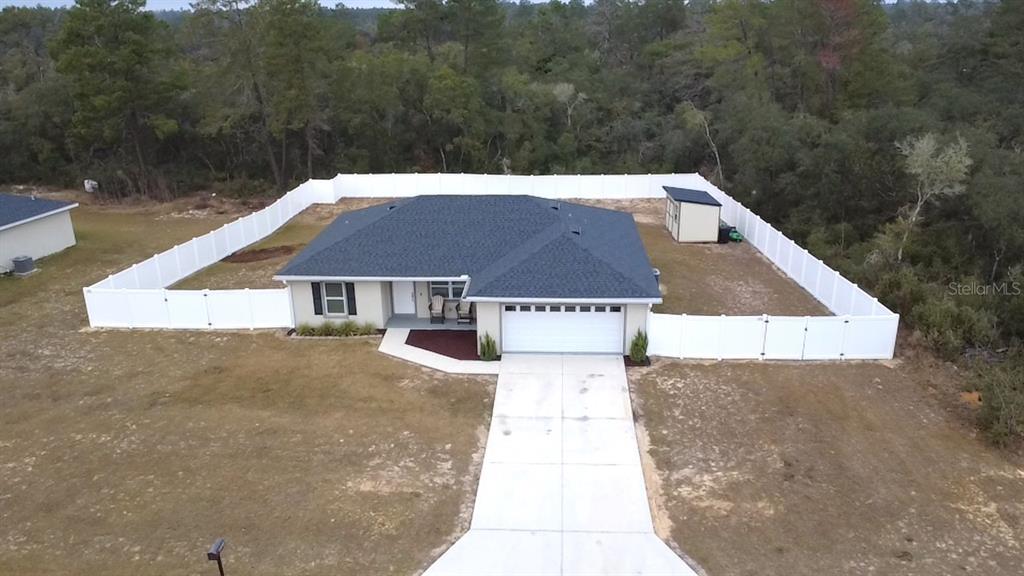 3791 Southwest 166th Pl Road Ocala, FL 34473 - Photo 25 of 43 a view of a house with a yard