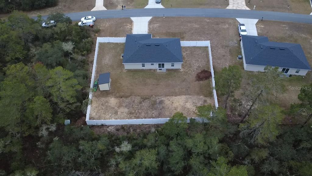 3791 Southwest 166th Pl Road Ocala, FL 34473 - Photo 29 of 43 an aerial view of a house with a yard and a garage