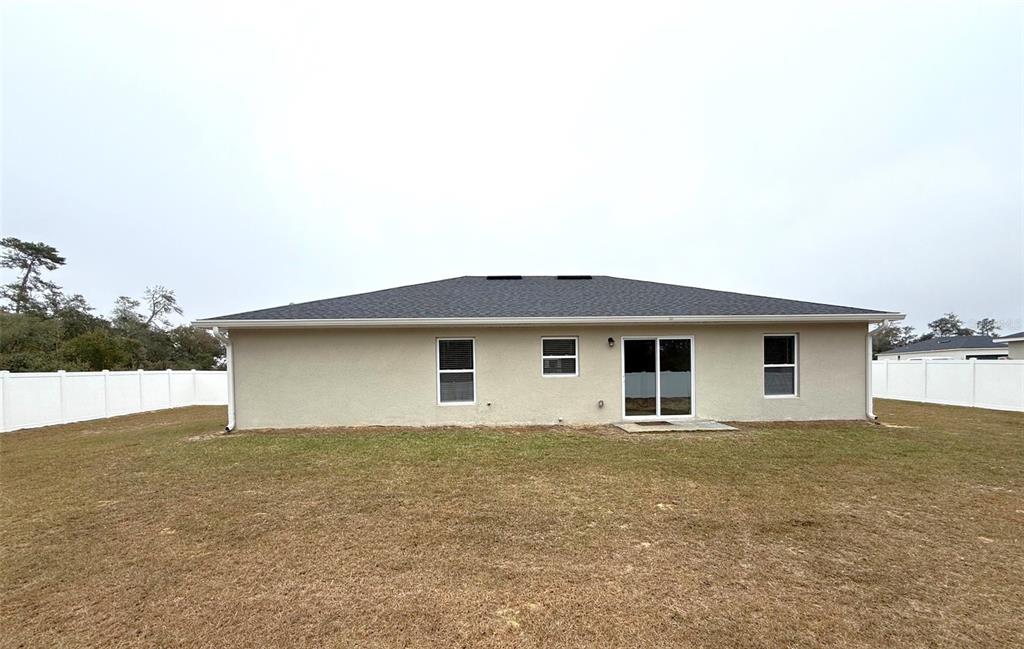 3791 Southwest 166th Pl Road Ocala, FL 34473 - Photo 36 of 43 a front view of house with yard and garage