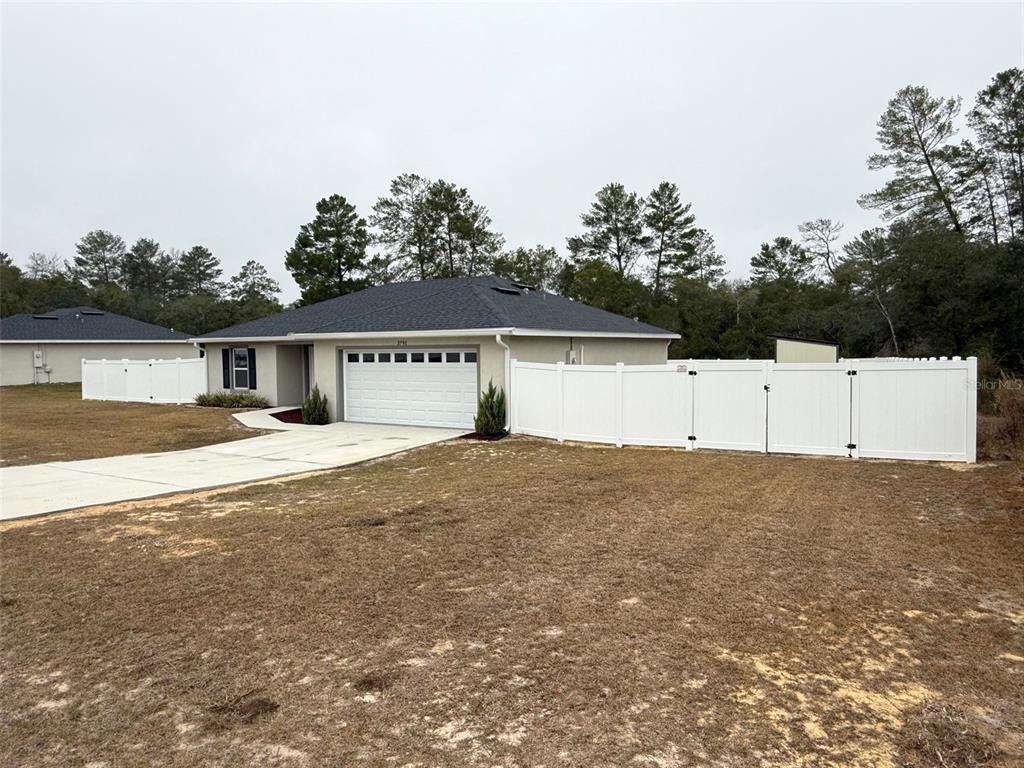 3791 Southwest 166th Pl Road Ocala, FL 34473 - Photo 39 of 43 front view of a house with a yard