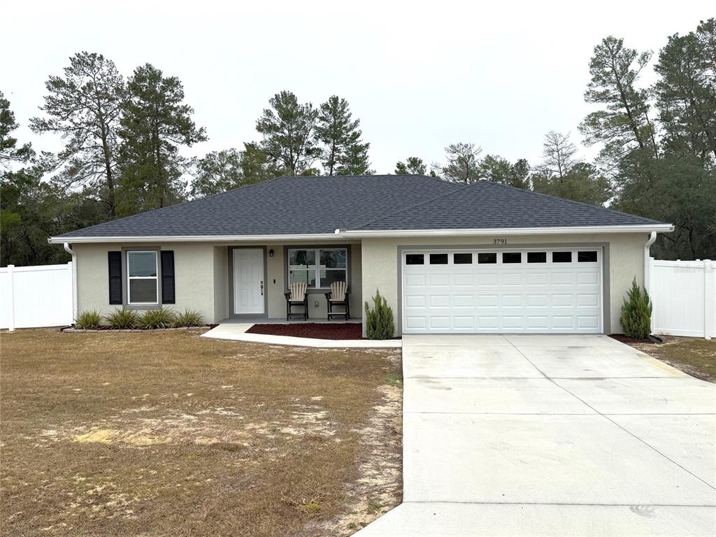 3791 Southwest 166th Pl Road Ocala, FL 34473 - Photo 41 of 43 a view of a yard in front of a house