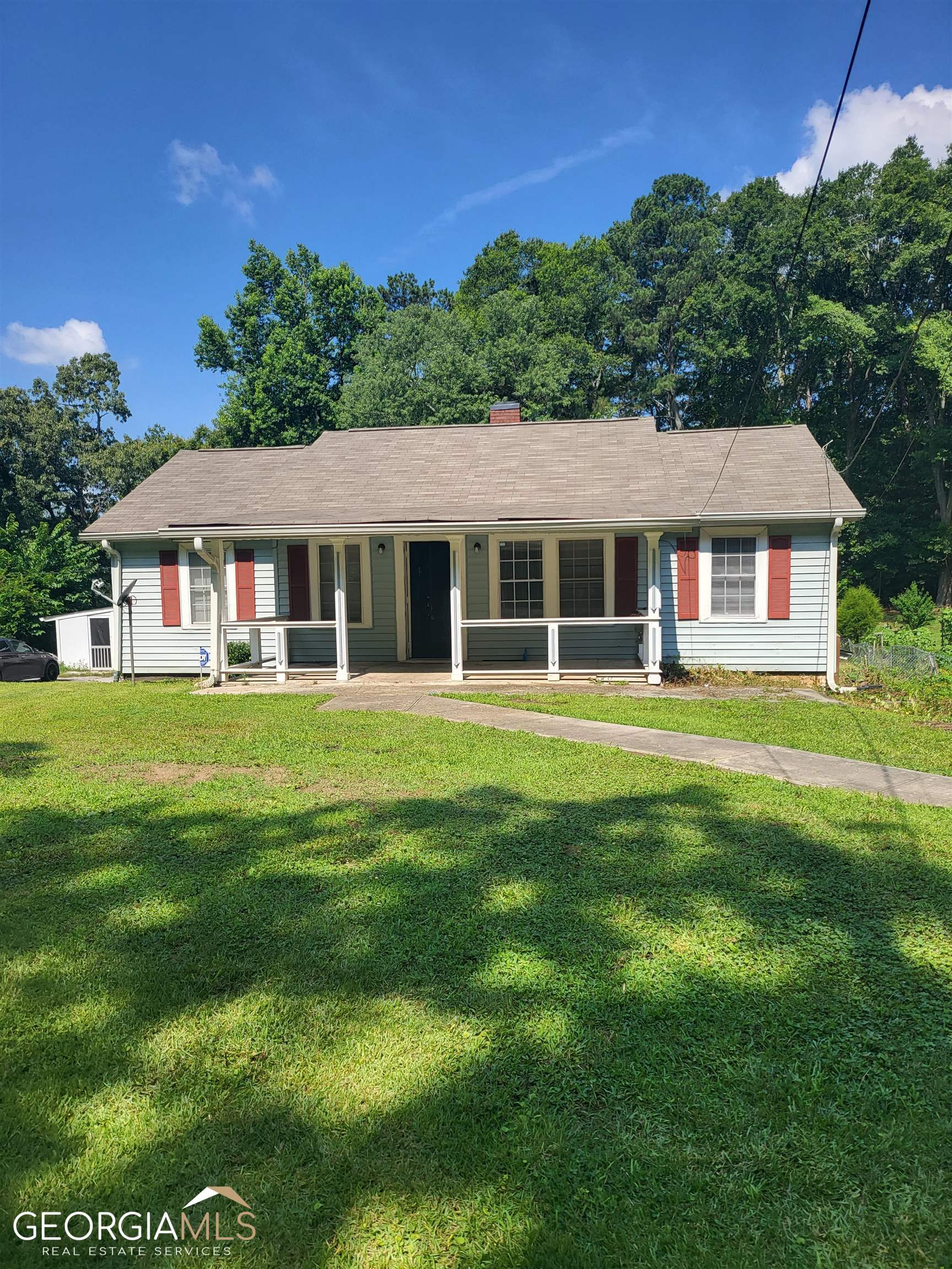 6819 Mark Turner Road Lithia Springs, GA 30122 - Photo 17 of 17 a front view of a house with a yard