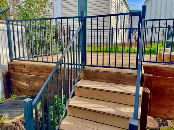 a view of a balcony with wooden floor