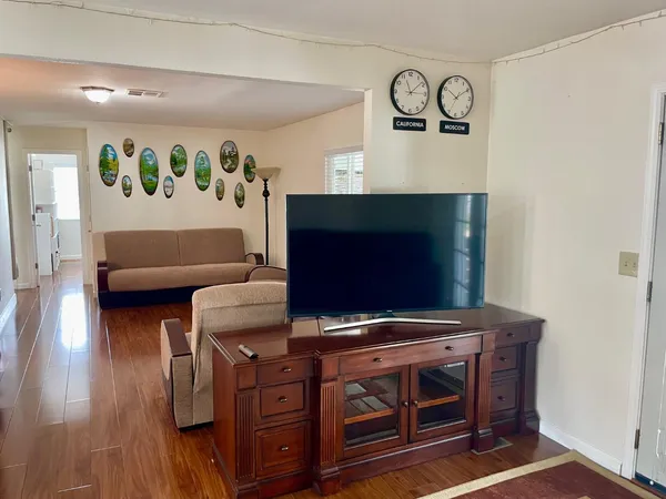 a living room with furniture and a flat screen tv
