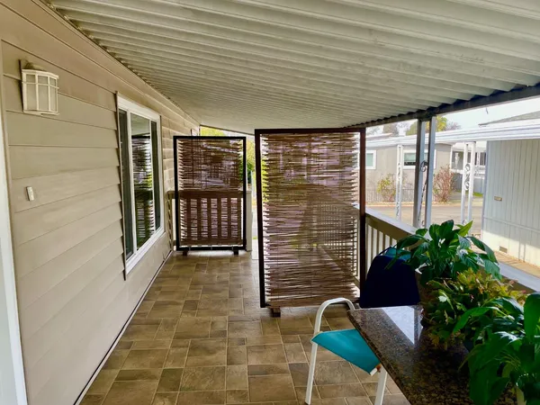 a porch with seating space
