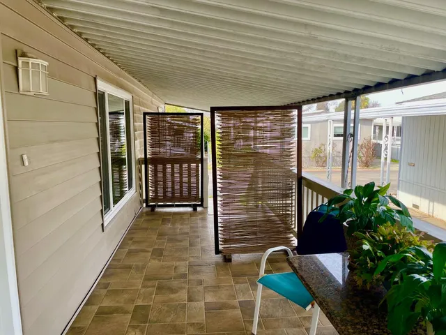 a living room with furniture rug and a flat screen tv