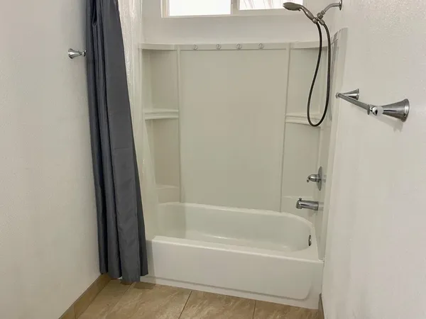 a bathroom with a bath tub