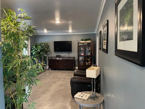 a living room with furniture and a flat screen tv