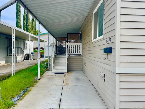 a view of a back yard of the house