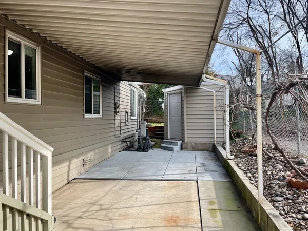 a view of backyard with cabin