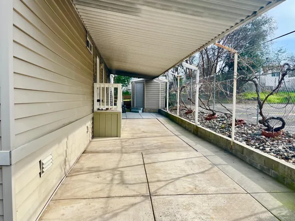 a view of a porch with wooden fence
