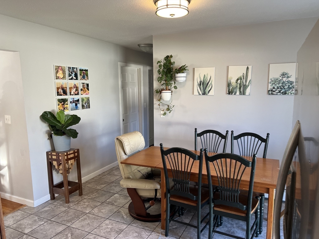 61 Southern Road Springfield, MA 01129 - Photo 11 of 35 a dining room with furniture and wooden floor