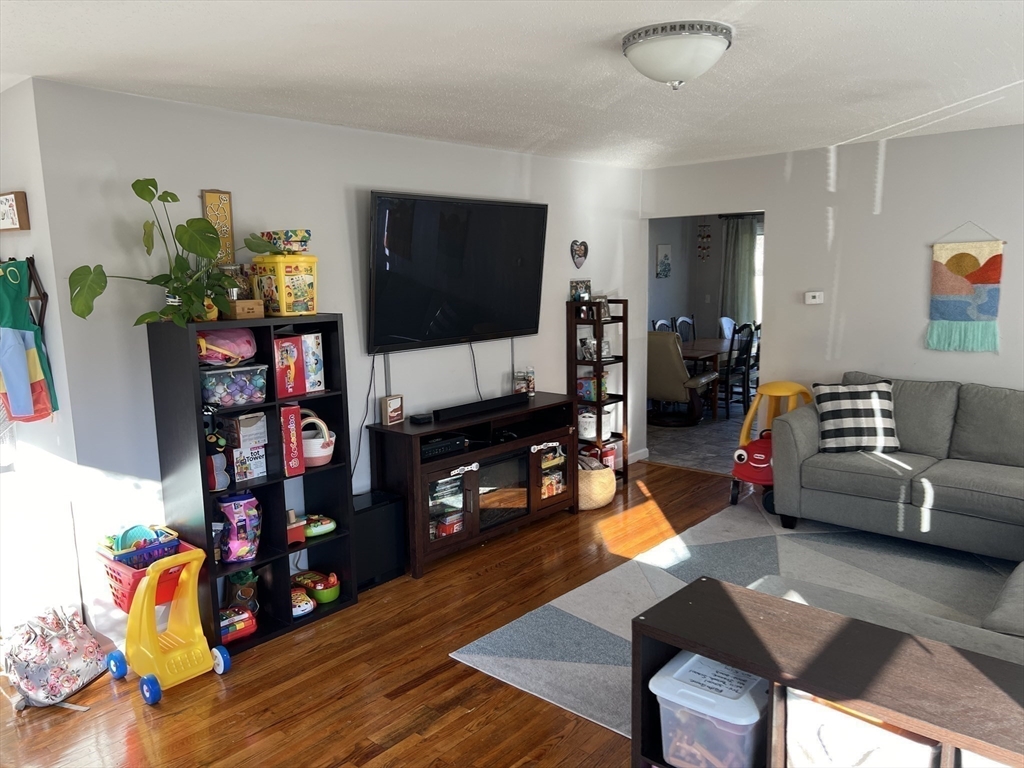 61 Southern Road Springfield, MA 01129 - Photo 16 of 35 a living room with furniture and a flat screen tv
