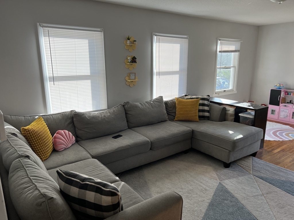 61 Southern Road Springfield, MA 01129 - Photo 17 of 35 a living room with a couch and a window