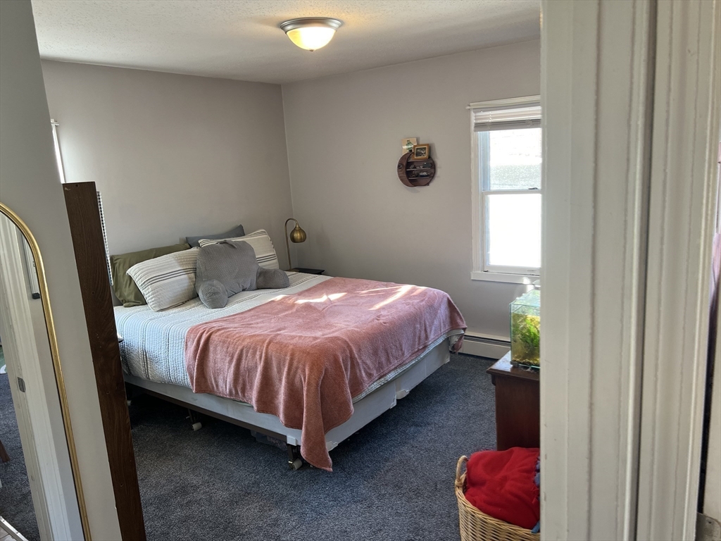 61 Southern Road Springfield, MA 01129 - Photo 22 of 35 a bedroom with a bed and a window