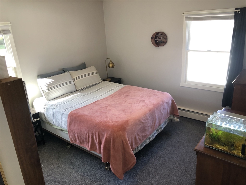 61 Southern Road Springfield, MA 01129 - Photo 23 of 35 a bed sitting in a bedroom next to a window