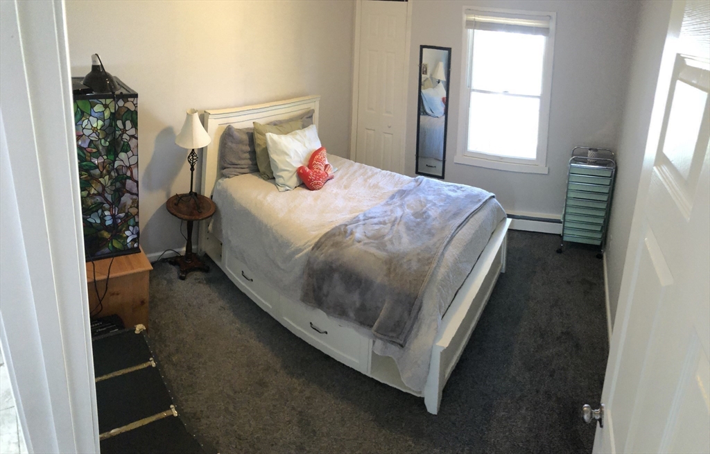 61 Southern Road Springfield, MA 01129 - Photo 29 of 35 a bed sitting in a bedroom next to a window