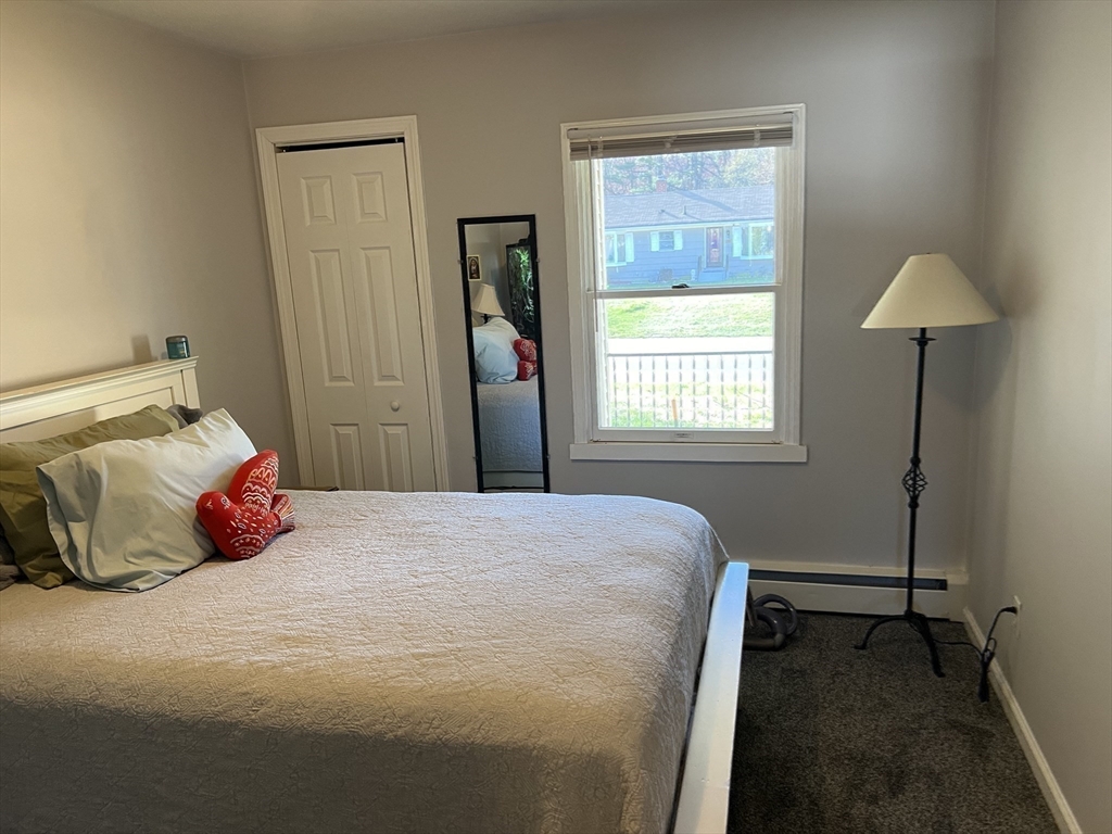 61 Southern Road Springfield, MA 01129 - Photo 30 of 35 a bedroom with a bed and a window