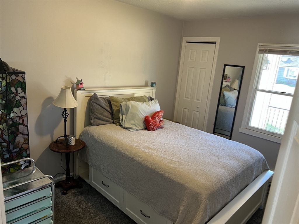 61 Southern Road Springfield, MA 01129 - Photo 31 of 35 a bedroom with a bed and wooden floor