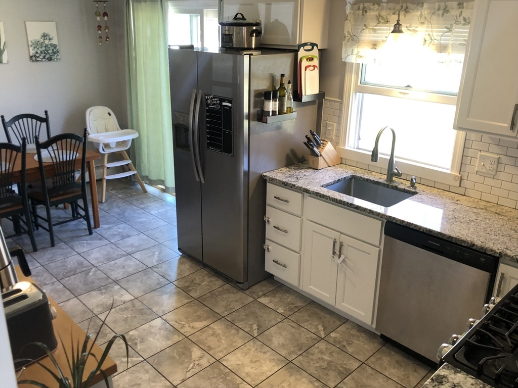 61 Southern Road Springfield, MA 01129 - Photo 9 of 35 a kitchen with stainless steel appliances a sink and a refrigerator