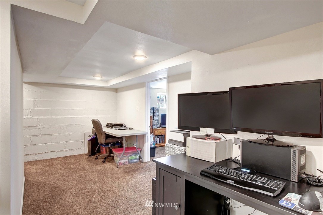 5803 Lowell Road Everett, WA 98203 - Photo 14 of 23 a room with furniture and a flat screen tv