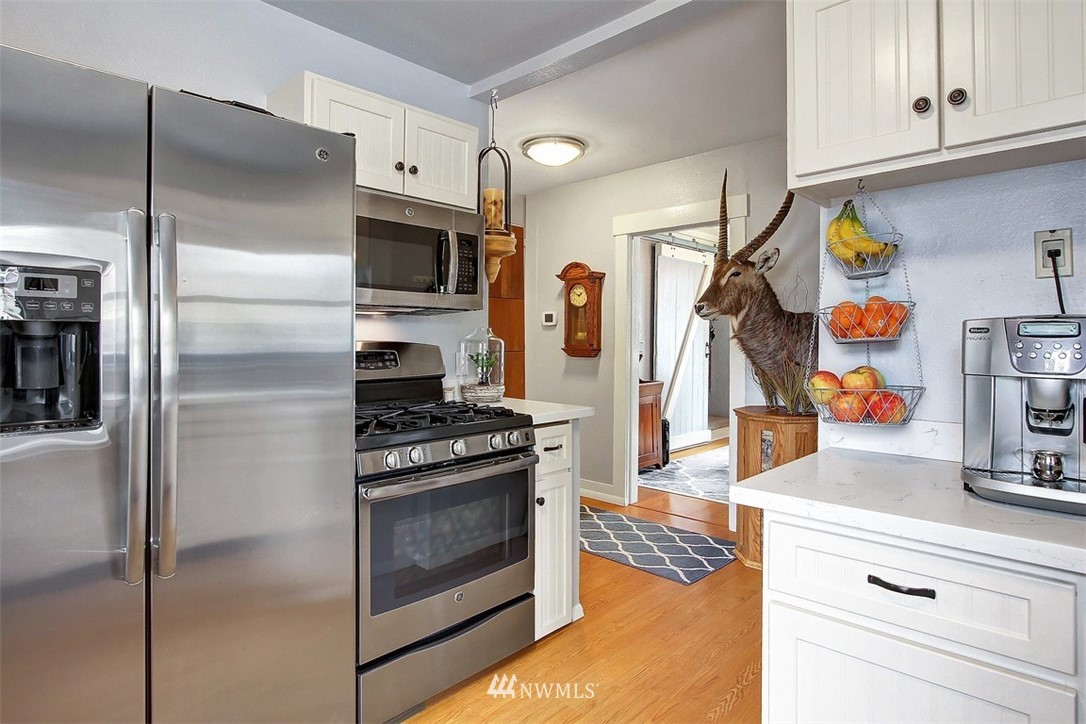 5803 Lowell Road Everett, WA 98203 - Photo 8 of 23 a kitchen with stainless steel appliances granite countertop a refrigerator and a stove top oven