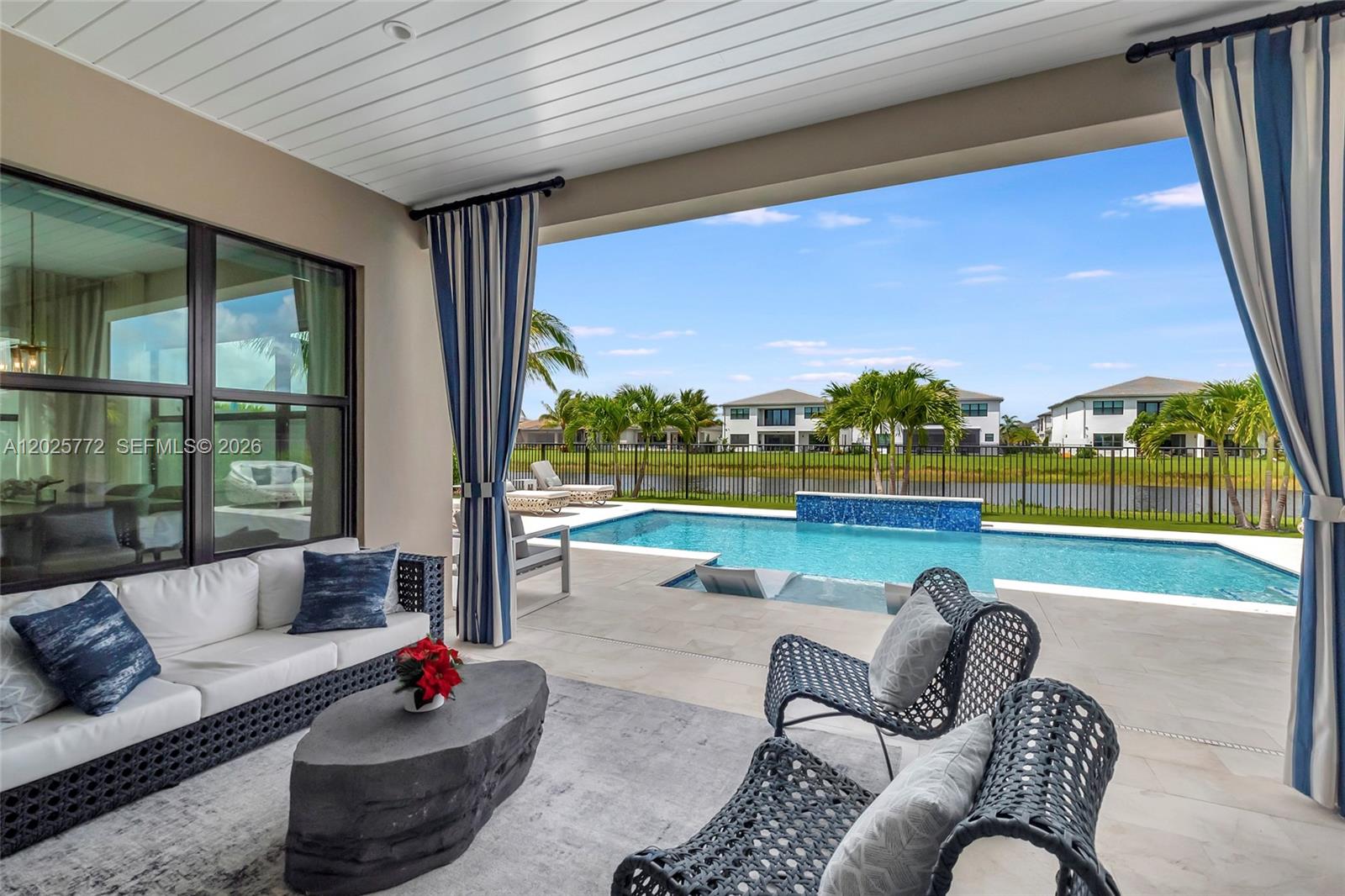 17023 Wandering Wave Avenue Boca Raton, FL 33496 - Photo 28 of 84 a outdoor living space with furniture and garden view