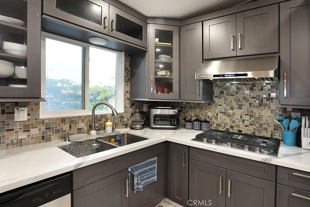 9802 Chanticleer Road Anaheim, CA 92804 - Photo 11 of 31 a kitchen with a sink and cabinets