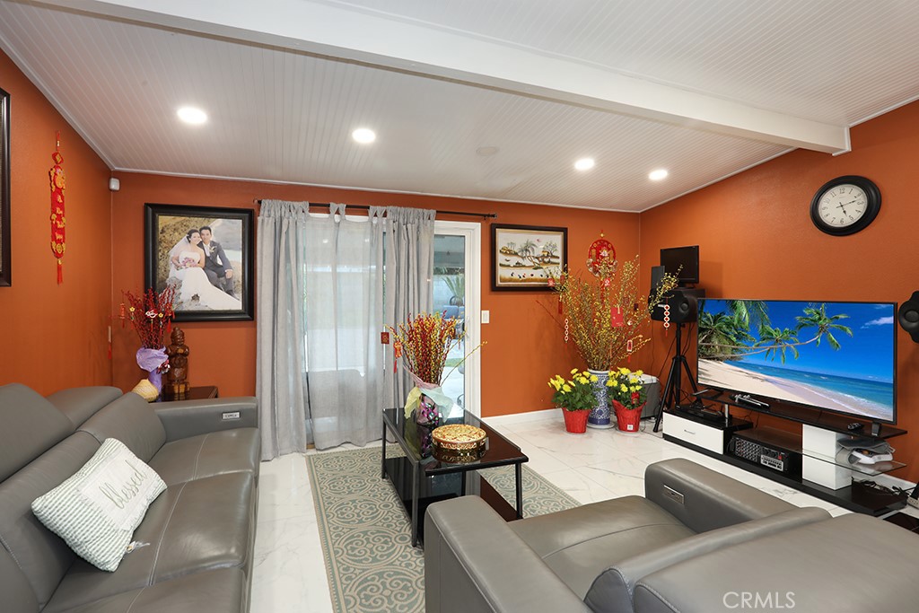 9802 Chanticleer Road Anaheim, CA 92804 - Photo 13 of 31 a living room with furniture and a flat screen tv