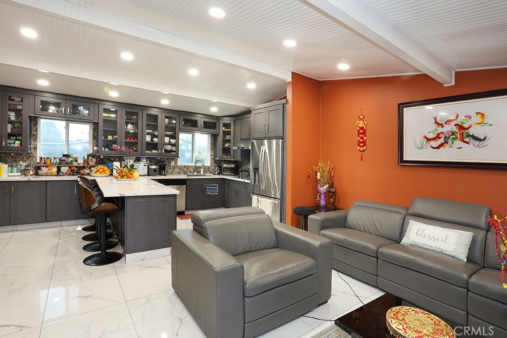 9802 Chanticleer Road Anaheim, CA 92804 - Photo 15 of 31 a living room with furniture and kitchen view