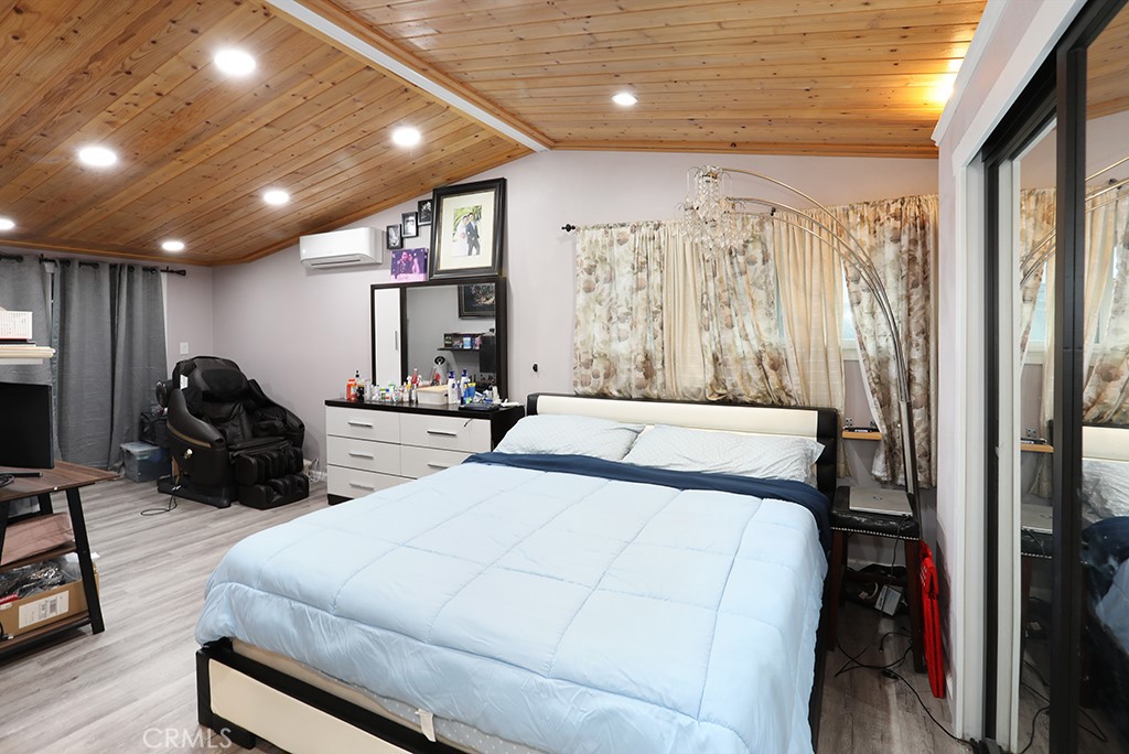 9802 Chanticleer Road Anaheim, CA 92804 - Photo 22 of 31 a bed room with two bed and a large window