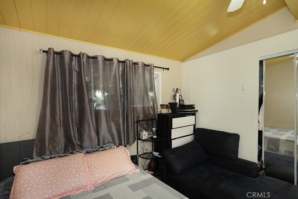 9802 Chanticleer Road Anaheim, CA 92804 - Photo 24 of 31 a bedroom with a bed and a dresser