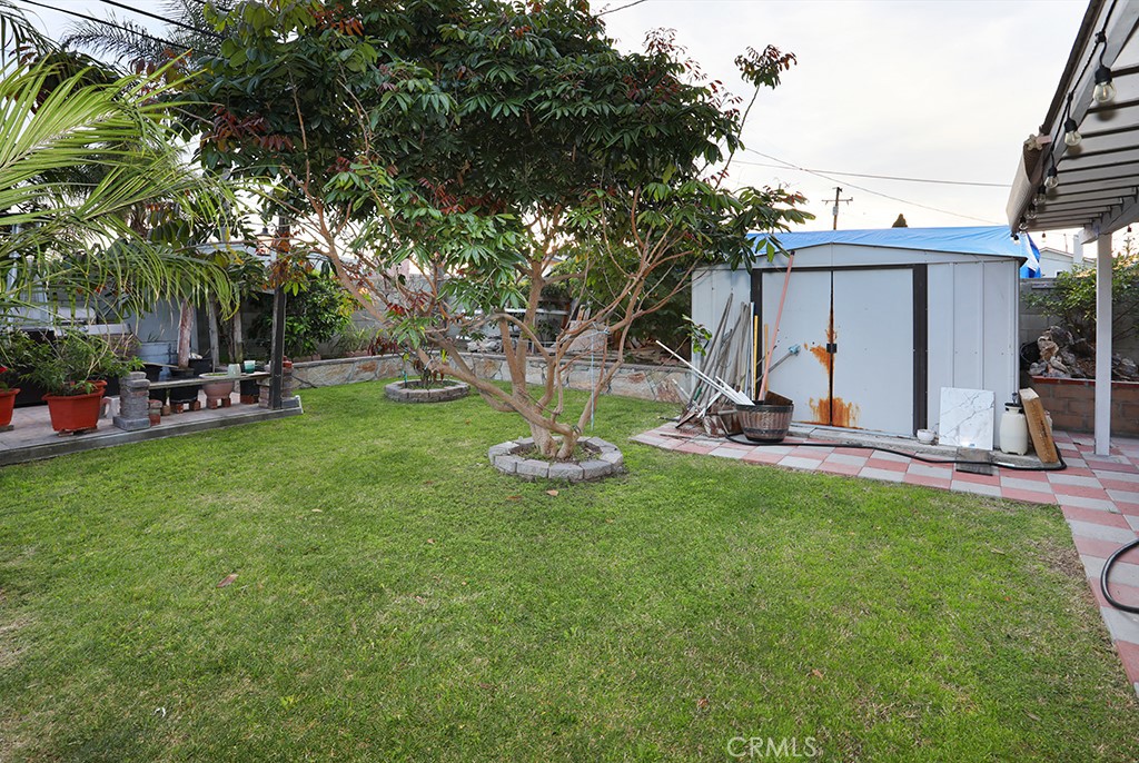 9802 Chanticleer Road Anaheim, CA 92804 - Photo 27 of 31 a view of a backyard with a patio