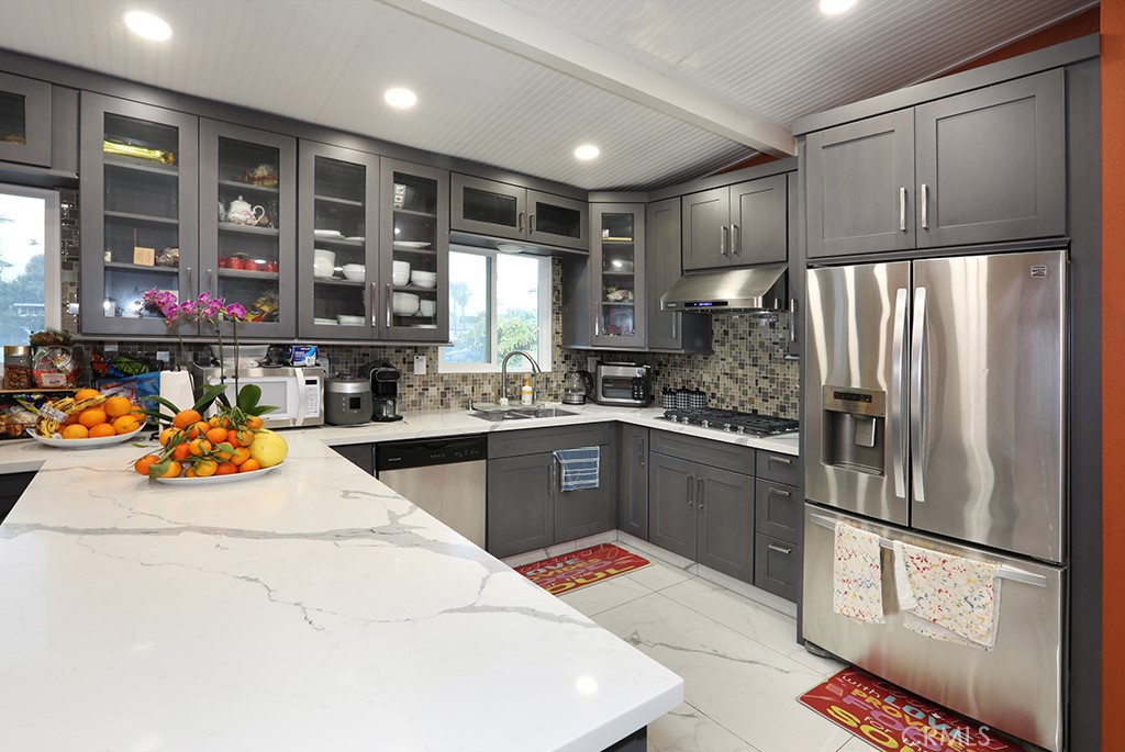 9802 Chanticleer Road Anaheim, CA 92804 - Photo 8 of 31 a kitchen with stainless steel appliances granite countertop a refrigerator sink stove and oven