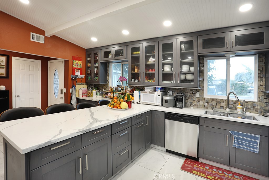 9802 Chanticleer Road Anaheim, CA 92804 - Photo 10 of 31 a kitchen with a sink appliances and a large window