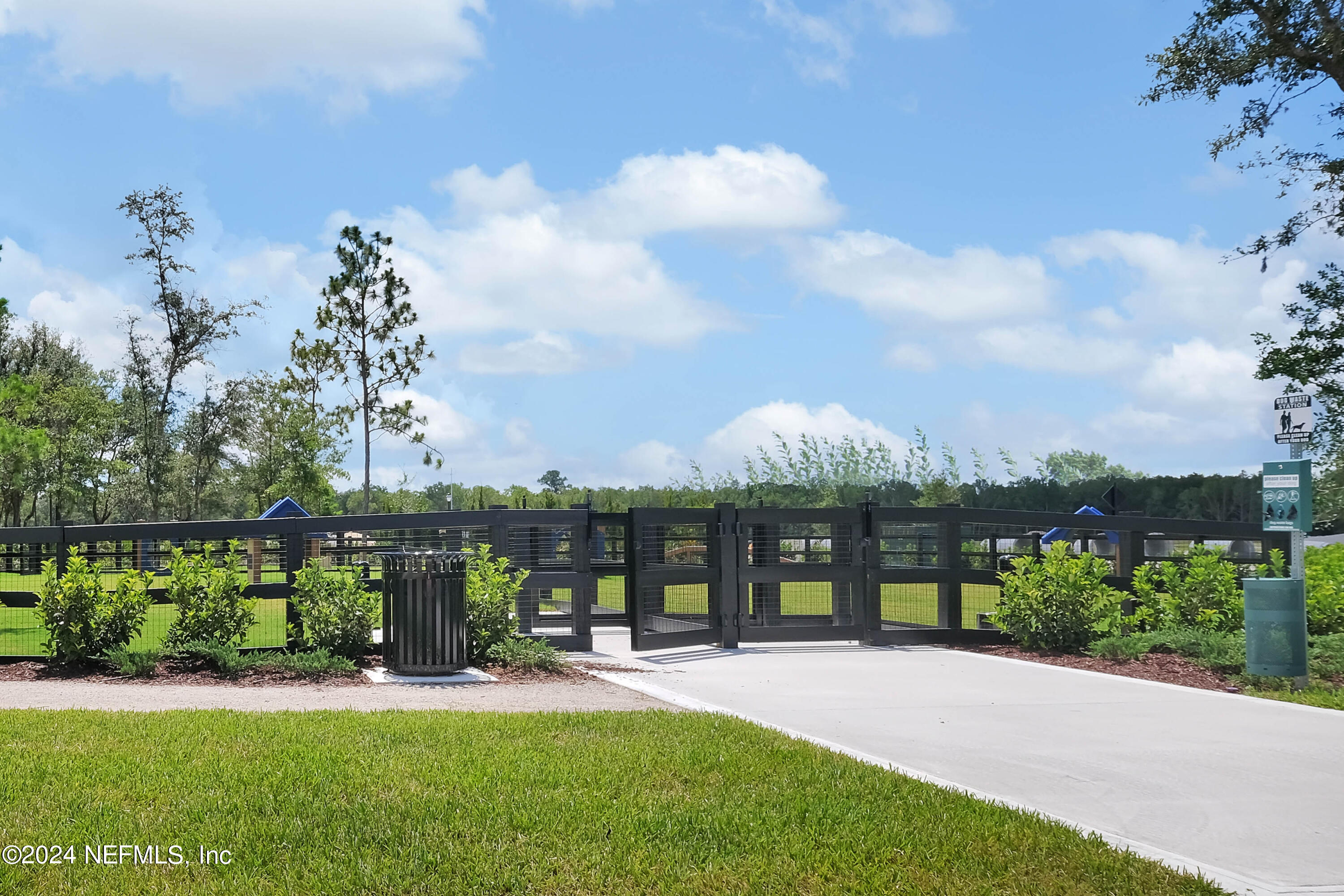 207 Merchant Avenue St. Johns, FL 32259 - Photo 12 of 54 a front view of a house with a yard table and chairs
