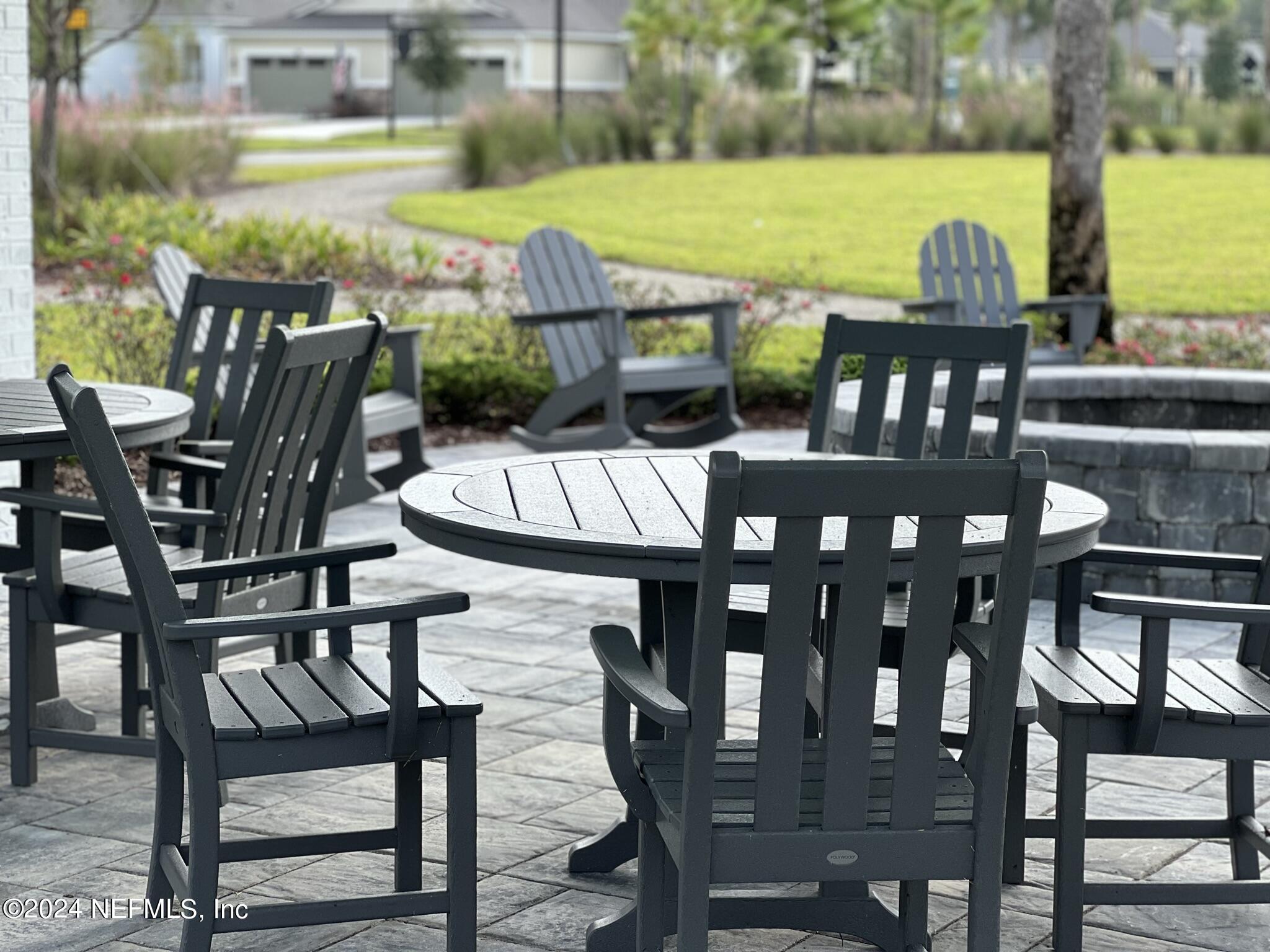 207 Merchant Avenue St. Johns, FL 32259 - Photo 19 of 54 a view of a chairs and table in patio