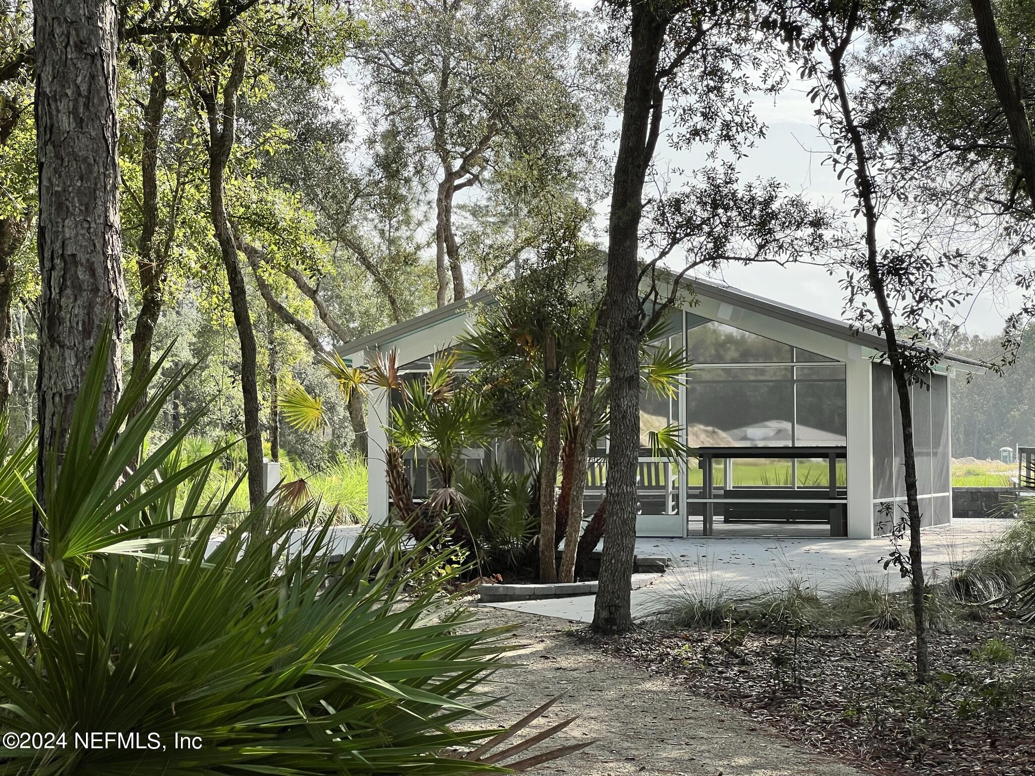 207 Merchant Avenue St. Johns, FL 32259 - Photo 25 of 54 a view of a park with large trees