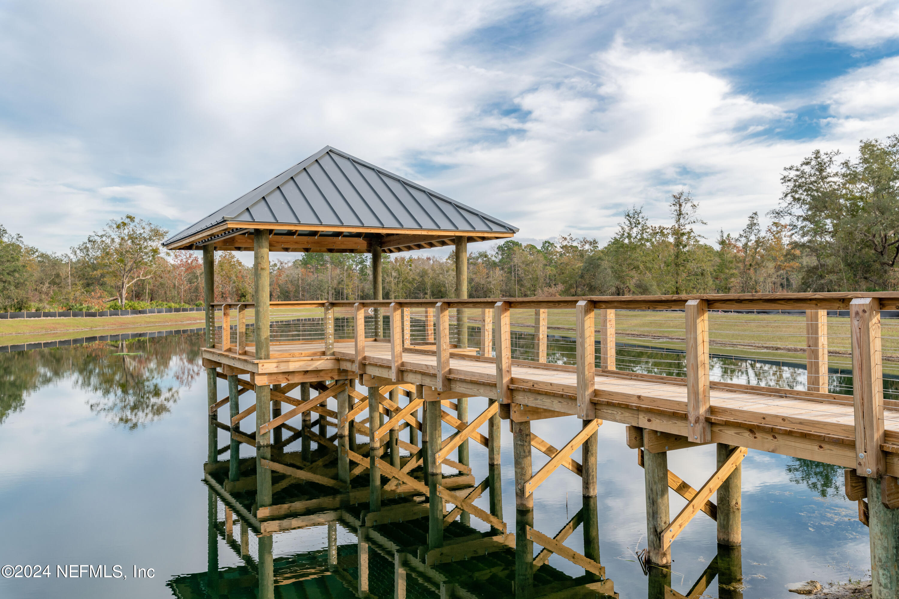207 Merchant Avenue St. Johns, FL 32259 - Photo 10 of 54 an outdoor space with swimming pool and furniture
