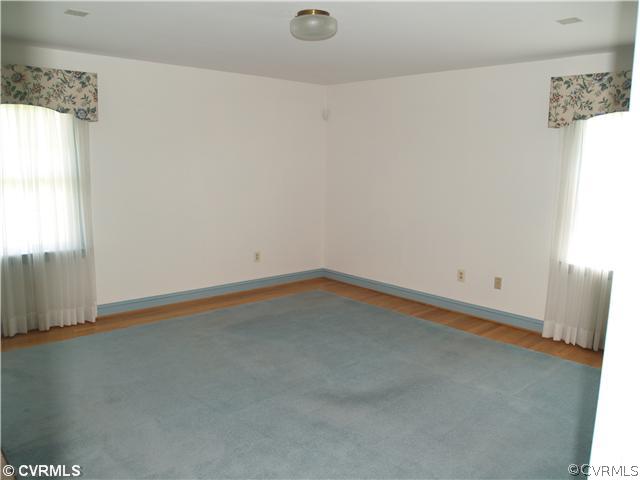 8139 Airport Road Quinton, VA 23141 - Photo 8 of 12 Master Bedroom - 15' x 15' MBR w/Area Rug on Hardw